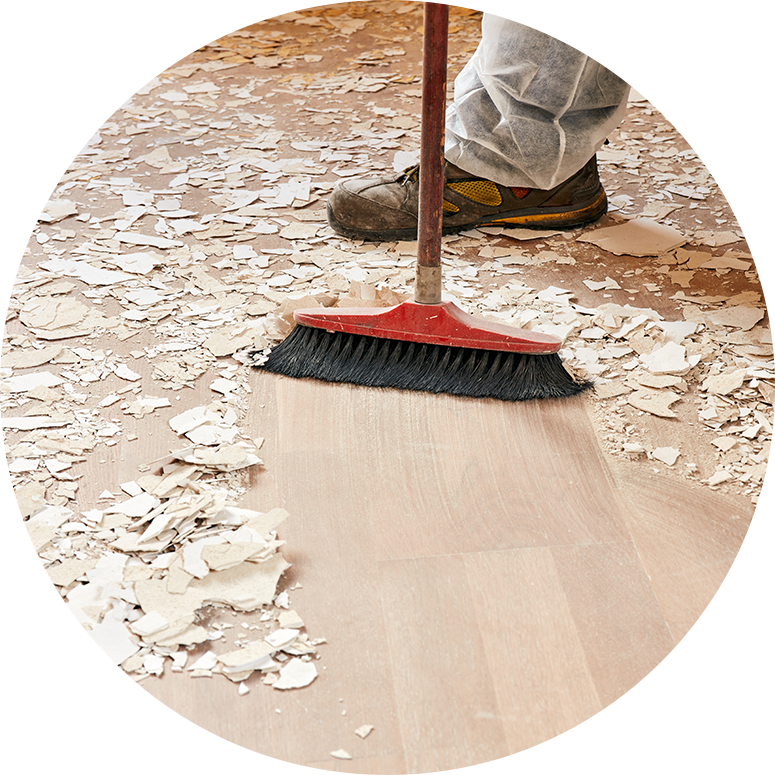 Man sweeping debris