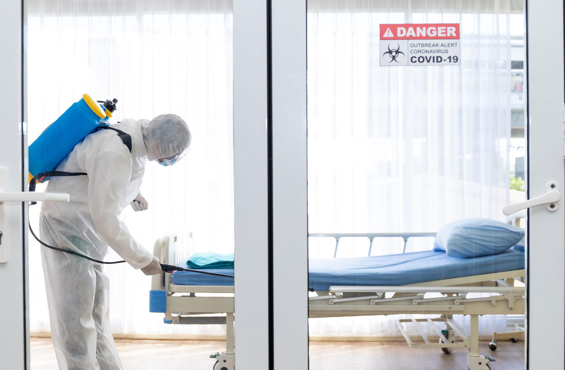Man disinfecting area