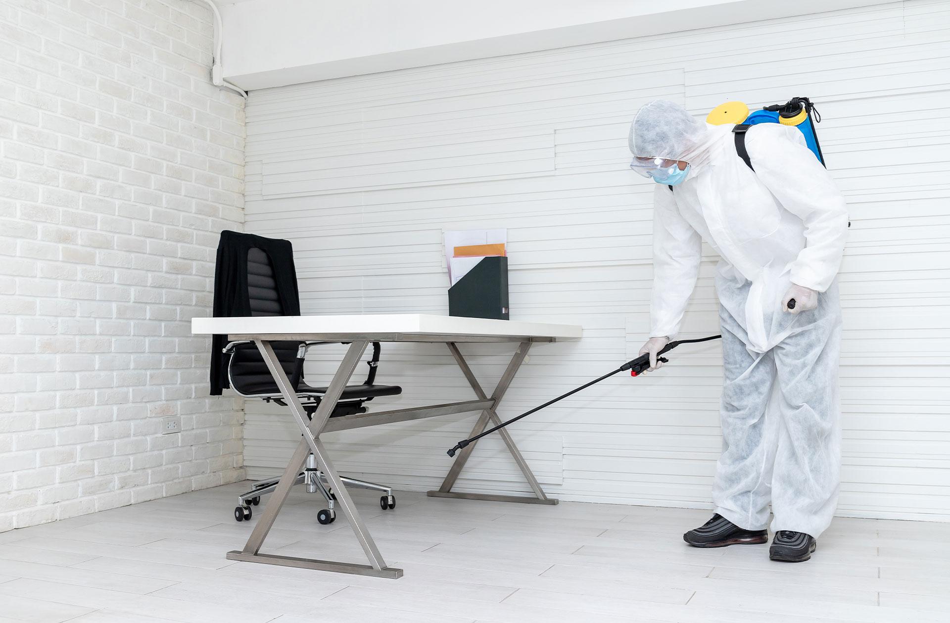 Man cleaning desk